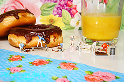 The glazers worked diligently to make and spread the yummy chocolate.- Photography by Lon Casler Bixby - Copyright - All Rights Reserved - www.whileyouweresleeping.photography/